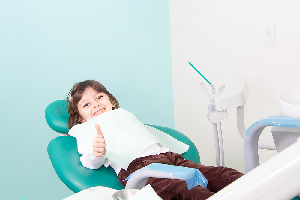 happy child in dentist chair